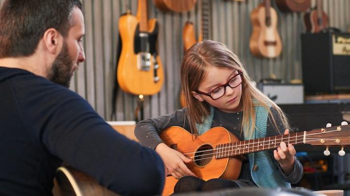 Student learning guitar